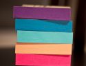 Image of different coloured post-it note pads. Illustrative.