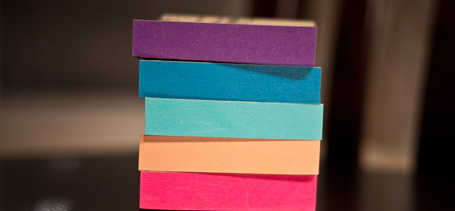 Image of different coloured post-it note pads. Illustrative.